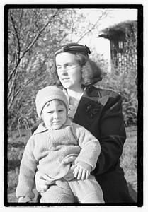 Maude Sanromá holding a child