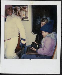 Two girls and a young woman on the T
