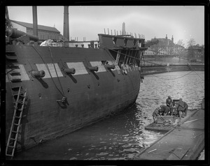 Navy Yard divers going down to take measurements of the hull of old frigate Constitution