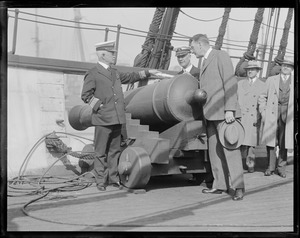 Secretary of Navy Wilbur and Admiral Andrews inspect cannon on USS Constitution