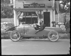 Roadster in front of model boat and toy shop, Manchester-by-the-Sea