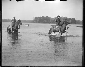 U.S. soldiers watering their horses before long journey during war games