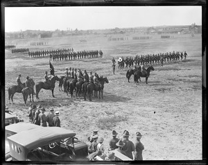 Infantry march on parade ground at Fort Devens in Ayer