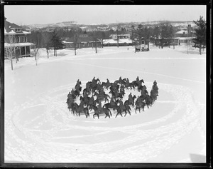 Horses maneuver in tight circus during calvary exercises in snow, Fort Ethan Allen, Burlington, Vermont