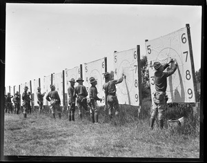 Examining targets on the rifle range, Camp Devens