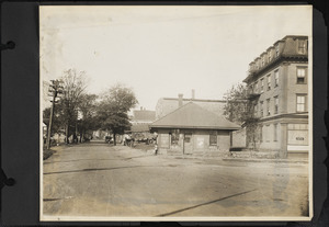 View looking west on Pearl Street from railroad crossing toward Hancock Street showing cobbler shop on right and windows of Hampton House.
