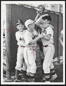 Jubilant Greeting for home-run hitter Bill Saltzman of Brookline North, right, after he scores on three-run homer in last night’s Little League tournament game against Brighton Central at Si Rosenthal Field, Dorchester. Brookline North won District 10 semi-final by a 10-6 score.