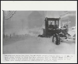 Bangor, Maine. "Maine Heavy Snowfall" Shown above is of the many plows trying to keep the Main streets open in Bangor after belashed with a wind driven 15 inch snowfall that is still raging at this time late Sunday afternoon.