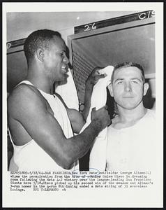 New York Mets' outfielder George Altman (L) wipes the perspiration from the brow of pitcher Galen Cisco in dressing room following the Mets 4-2 victory over the league-leading San Francisco Giants here 5/18. Cisco picked up his second win of the season and Altman's 3-run homer in the 4-run 8th inning ended a Mets string of 31 scoreless innings.