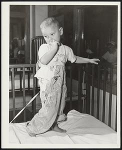 Polio Patient, 2 1/2-year-old Raymond Fuller Has A Real Problem. He’s losing his pants. The kid with the overall enigma is the son of Mr. and Mrs. Raymond Fuller, of 3631 South Kelly Street, Oklahoma City, Oklahoma, and is hospitalized at Crippled Children’s Hospital. Don’t worry Ray. A nurse will overhaul the overalls, and everyone who gives to the Polio Epidemic Emergency Drive of the National Foundation for Infantile Paralysis will help you and other little kids back to health.