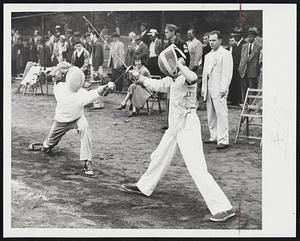 Something Different on Boston Common was yesterday’s fencing tournament, and here’s southpaw Robert Prescott of Lexington displaying his winning from over Donald Keaney of Brookline.