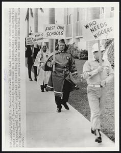 Ft. Lauderdale Fla. Ku Klux Klan raised their banners Wednesday night in front of Broward County Court House in a picket-blast at an alleged rape by Negroes. Local Klan head organized picket line, he's C.B. Riddlehoover, second from right. The march lasted about thirty minuets.