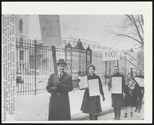 Boston – Children Or Concrete? – Pickets protesting a plan to widen and build underpasses along Memorial Drive in Cambridge parade in front of State House, Boston, today. Protest is also aimed at plan to cut down sycamore trees bordering drive. Woman at right carries sign saying “Children or Concrete?”.