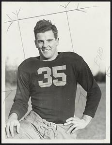 Captain Ernie Schwotzer of Boston College, who will lead his Eagle flock against Holy Cross in Fenway park this afternoon. Ernie plays left guard and comes from Waltham.