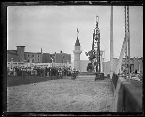 A crowd watching the Fearless Greggs perform their leapfrogging auto show at Paragon Park, Nantasket, Massachusetts
