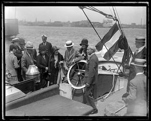 Mr. and Mrs. Henry Ford visit historic T-wharf to board Grenfell expedition schooner George B. Cluett off for Labrador