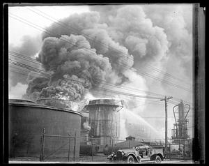 Firefighters using water hoses on an unidentified fire