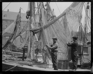 Mending nets at old T-wharf