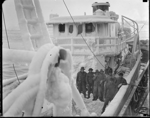 Fishing trawler Trimont covered in ice, fish pier