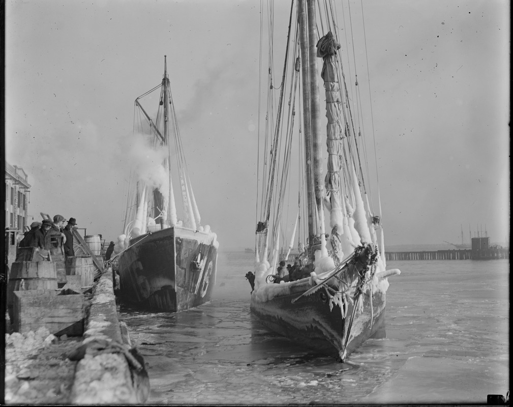 Ice clad fishing schooner docks at fish pier