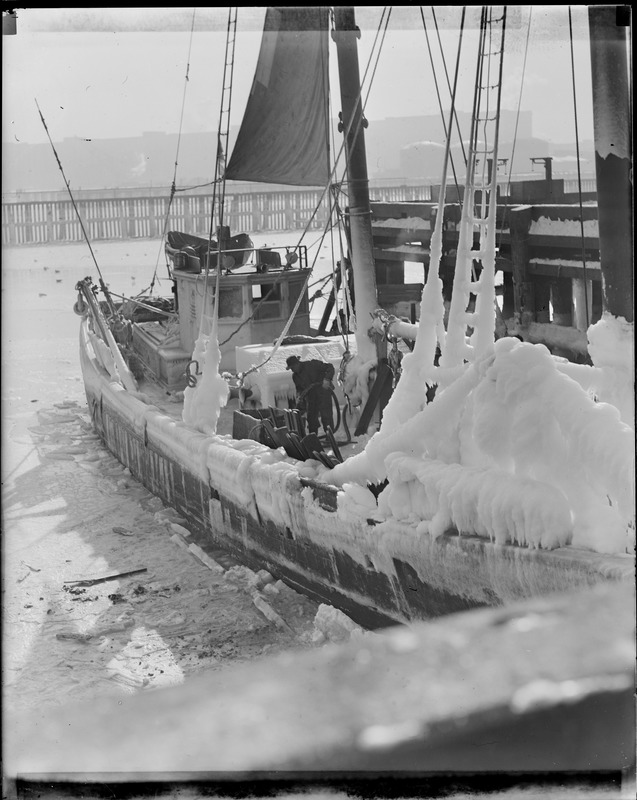 Ice covered fishing schooner, fish pier