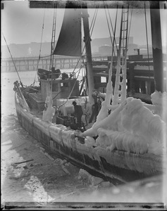 Ice covered fishing schooner at fish pier