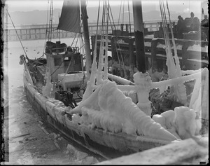 Ice covered fishing schooner at fish pier