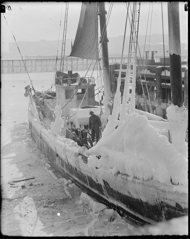 Ice clad fishing schooner at fish pier