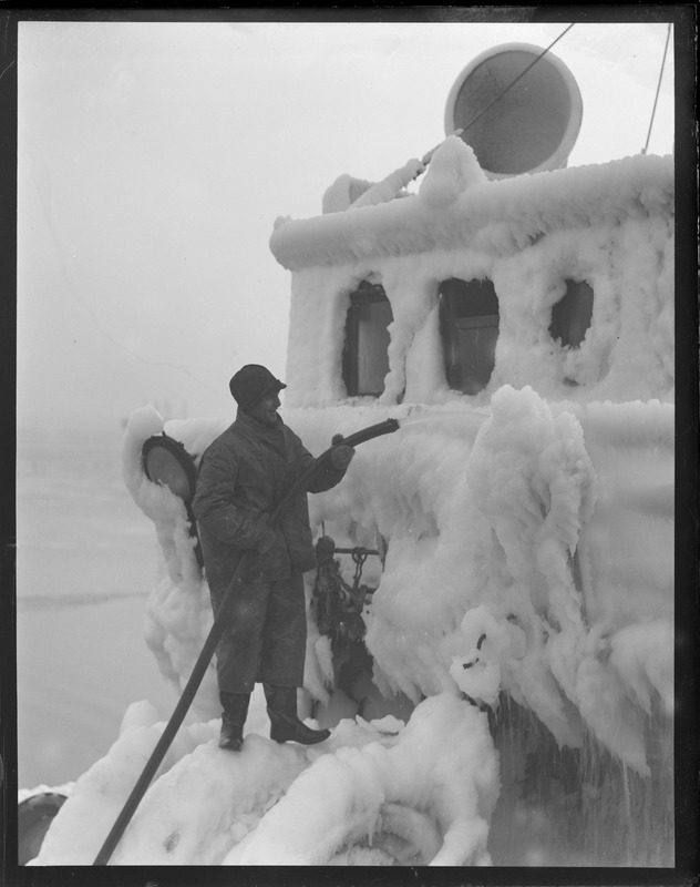 Ice-clad trawler at fish pier