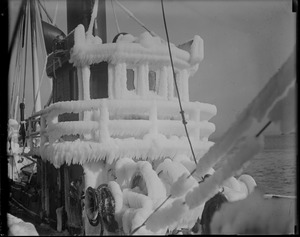 Pilot house of fish trawler covered in ice