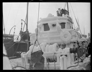Ice covered trawler at fish pier
