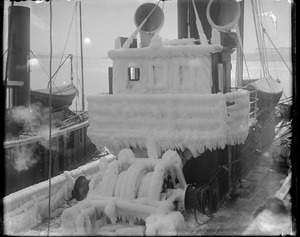 Pilot house of fish trawler covered in ice