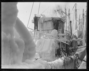 Ice covered trawler at fish pier