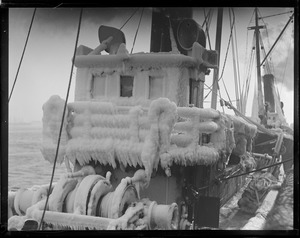 Ice covered trawler at fish pier