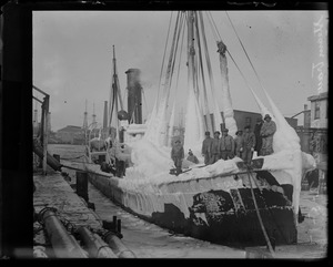 Ice covered steam trawler at South Boston fish pier