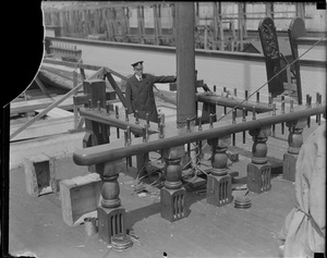 USS Constitution: Lt. John A. Lord, Naval Constructor of U.S. Navy, inspecting the main mast. He is man responsible in rebuilding the old frigate.