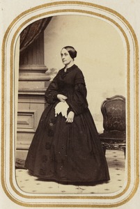 Portrait of a woman standing [G.S.H.?]