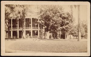 Curtis Hotel: front and right side, people talking on porch