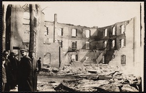 Easter Fire: men in front of brick shell