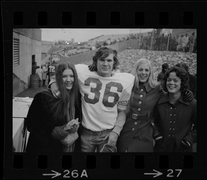 Boston College player Larry Molloy (36) standing with a group of women at game against Holy Cross at Schaefer Stadium