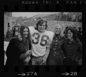 Boston College player Larry Molloy (36) standing with a group of women at game against Holy Cross at Schaefer Stadium