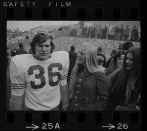 Boston College player Larry Molloy (36) speaking with two women at game against Holy Cross at Schaefer Stadium
