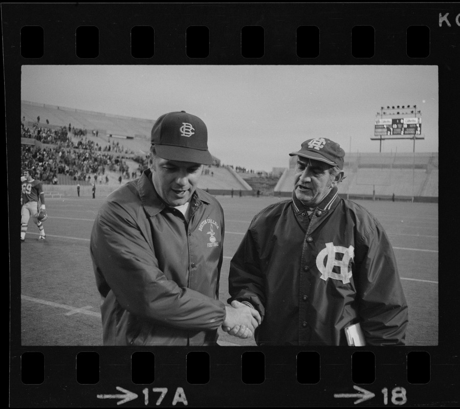 Boston College football coach Joe Yukica shakes hands with Holy Cross football coach Ed Doherty after game at Schaefer Stadium