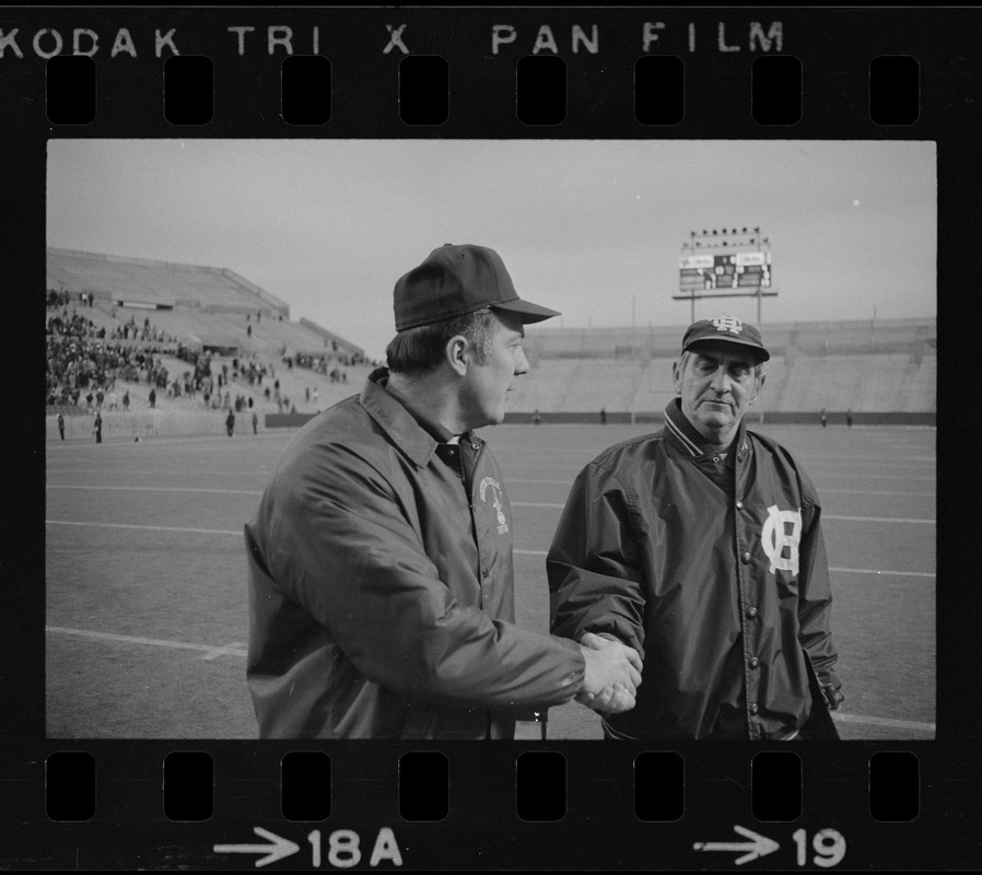 Boston College football coach Joe Yukica shakes hands with Holy Cross football coach Ed Doherty after game at Schaefer Stadium