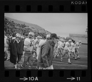 Boston College football coach Joe Yukica (center) and players walking off field after their win against Holy Cross at Schaefer Stadium
