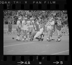 Referee tumbling while covering a play in Boston College vs. Holy Cross football game at Schaefer Stadium