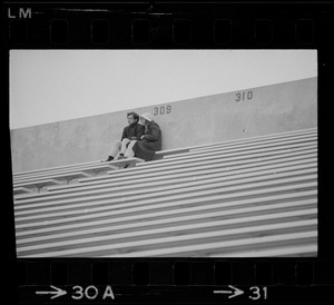 Spectators seen high up in the stands during a Boston College vs. Holy Cross football game at Schaefer Stadium