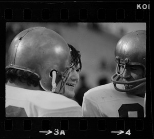 Boston College football players talking during game against Holy Cross at Schaefer Stadium