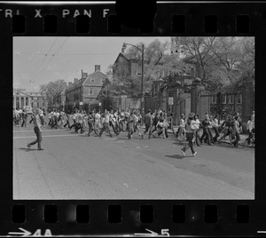 Students march across JFK Street in Cambridge toward Harvard Yard to protest US march into Cambodia and the killing of four Ohio students at Kent State