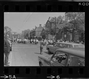 Students march across JFK Street in Cambridge toward Harvard Yard to protest against US march into Cambodia and the killing of four Ohio students at Kent State